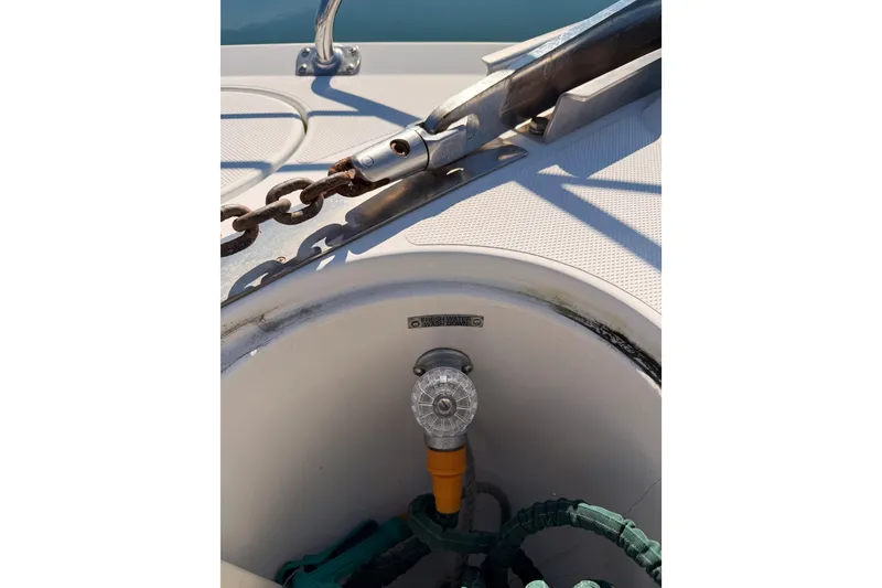 Slide: The Image of Anchor chain and deck fitting on a 1999 Carver 530 Voyager Pilothouse boat. - 17