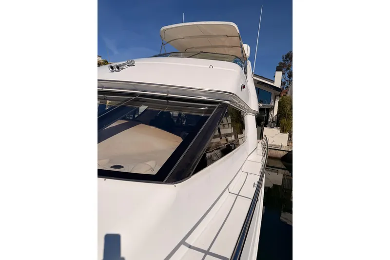Slide: The Image of 1999 Carver 530 Voyager Pilothouse yacht docked under clear blue sky. - 21