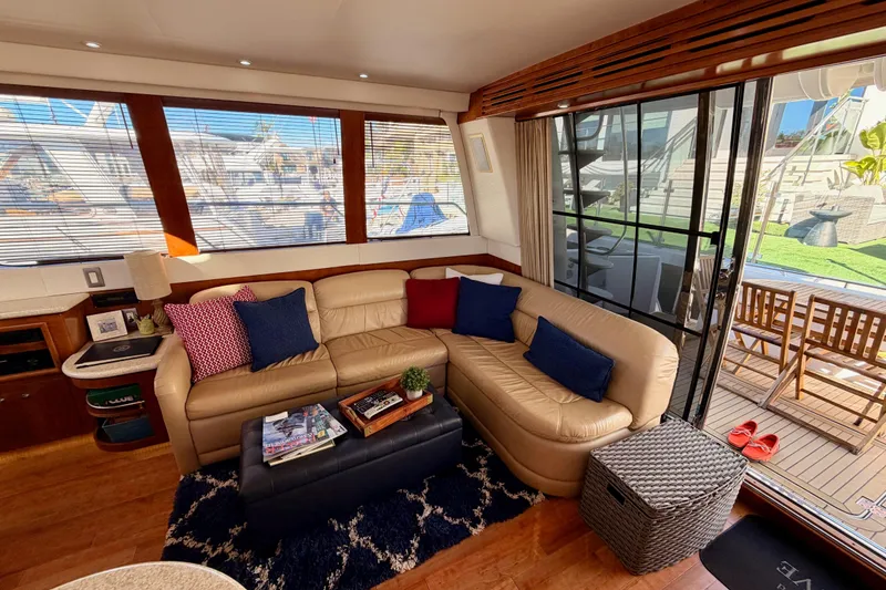 Slide: The Image of Luxurious interior of 1999 Carver 530 Voyager Pilothouse with leather seating and nautical decor. - 27