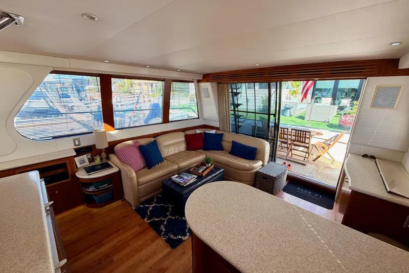 Slide: The Image of Luxurious interior of 1999 Carver 530 Voyager Pilothouse with leather seating and outdoor view. - 35