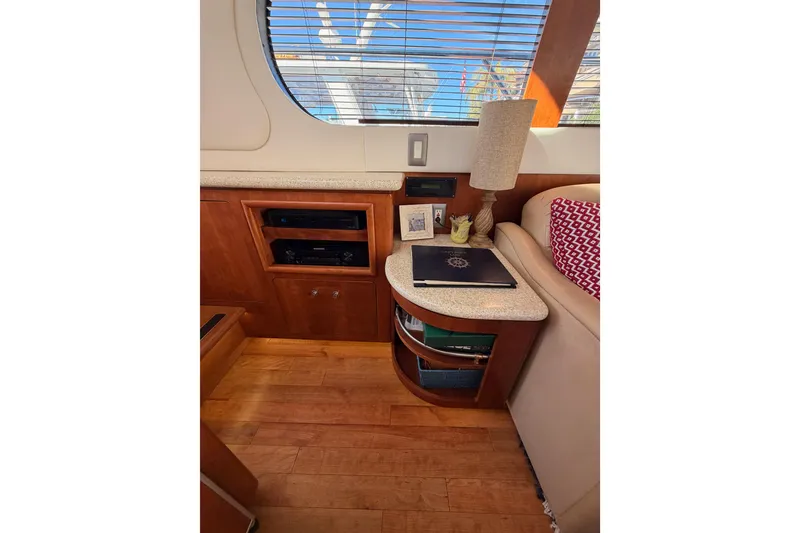 Slide: The Image of Interior of 1999 Carver 530 Voyager Pilothouse with wood cabinetry and decorative elements. - 36