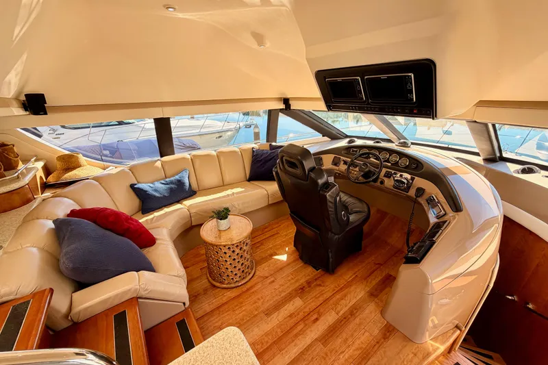Slide: The Image of Luxurious interior of 1999 Carver 530 Voyager Pilothouse with plush seating and modern helm. - 40