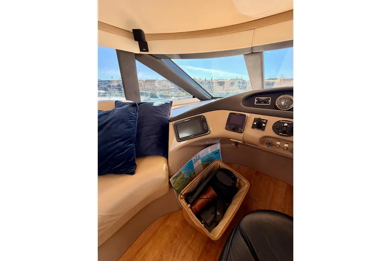 Slide: The Image of Interior view of 1999 Carver 530 Voyager Pilothouse with navigation equipment and seating. - 44