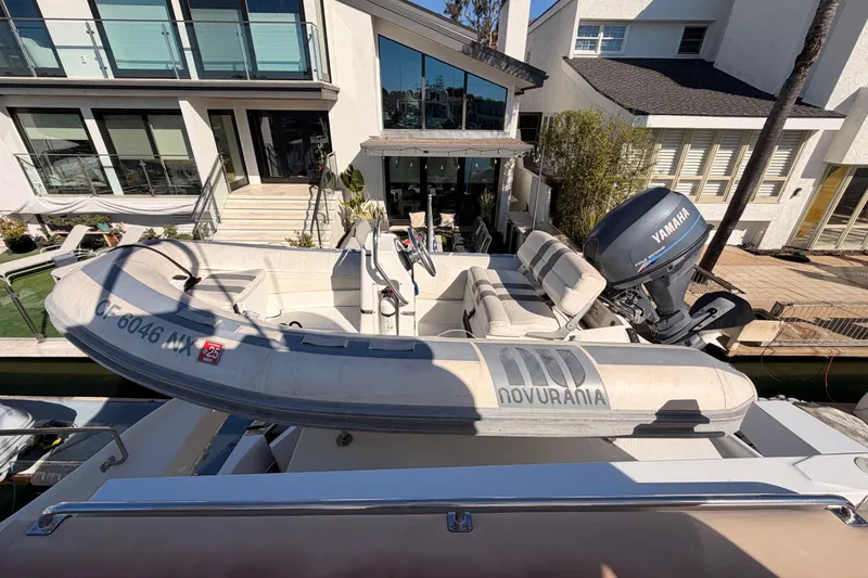 Slide: The Image of 1999 Carver 530 Voyager Pilothouse with Novurania tender and Yamaha outboard motor. - 63