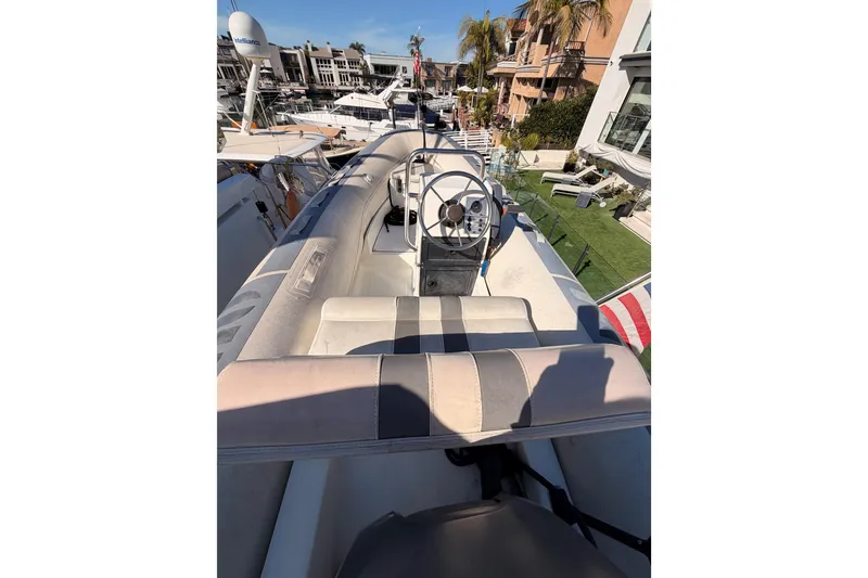 Slide: The Image of 1999 Carver 530 Voyager Pilothouse boat interior with steering wheel and seating area. - 65