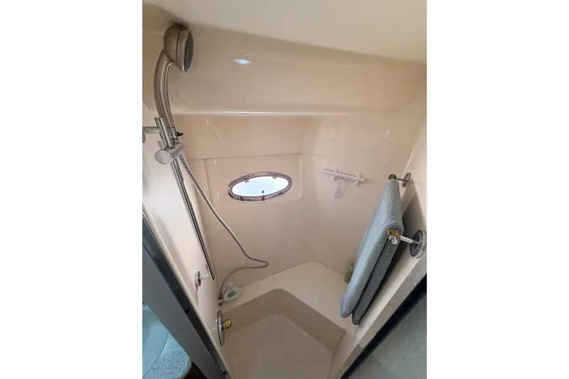 Slide: The Image of Shower area in 1999 Carver 530 Voyager Pilothouse with porthole and towel rack. - 85