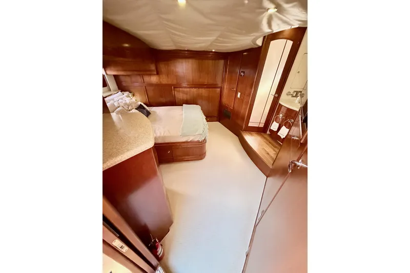 Slide: The Image of Luxurious interior of 1999 Carver 530 Voyager Pilothouse yacht bedroom. - 87