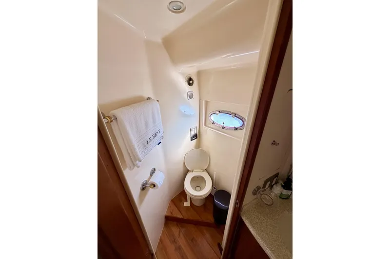 Slide: The Image of Bathroom interior of 1999 Carver 530 Voyager Pilothouse yacht with porthole window. - 96