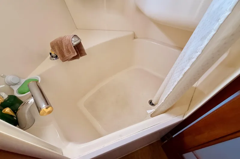 Slide: The Image of Shower area in 1999 Carver 530 Voyager Pilothouse with faucet and curtain. - 98