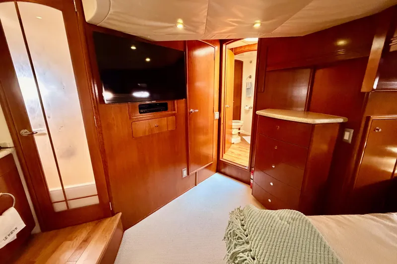 Slide: The Image of Luxurious interior of 1999 Carver 530 Voyager Pilothouse with wood finish and modern amenities. - 99