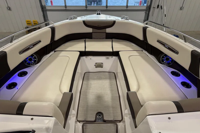Slide: The Image of 2019 Chaparral 317 SSX boat on trailer in warehouse. - 14