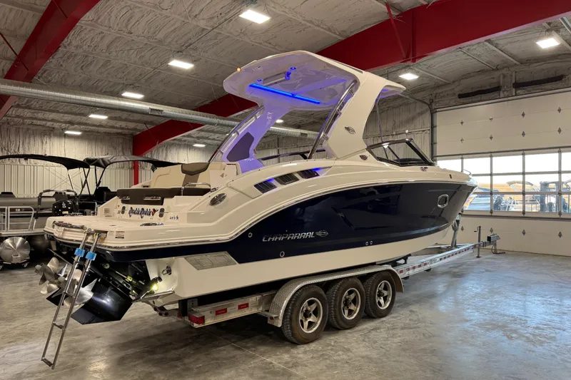 Slide: The Image of 2019 Chaparral 317 SSX boat on trailer in indoor showroom. - 3