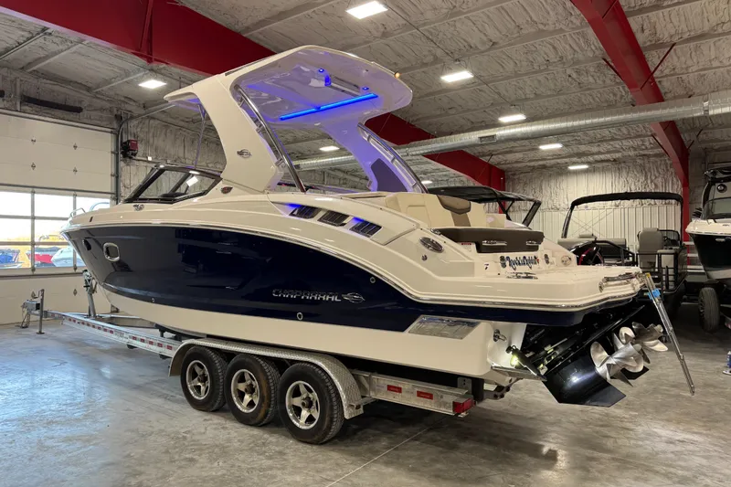 Slide: The Image of 2019 Chaparral 317 SSX boat on trailer in indoor storage facility. - 4