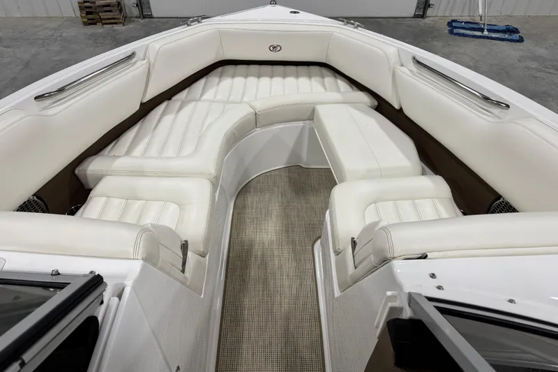 Slide: The Image of 2014 Cobalt R5 WSS boat interior with white leather seating and red accents. - 11