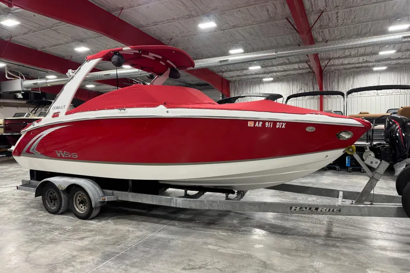 Slide: The Image of 2014 Cobalt R5 WSS boat interior with steering wheel and dashboard controls. - 14