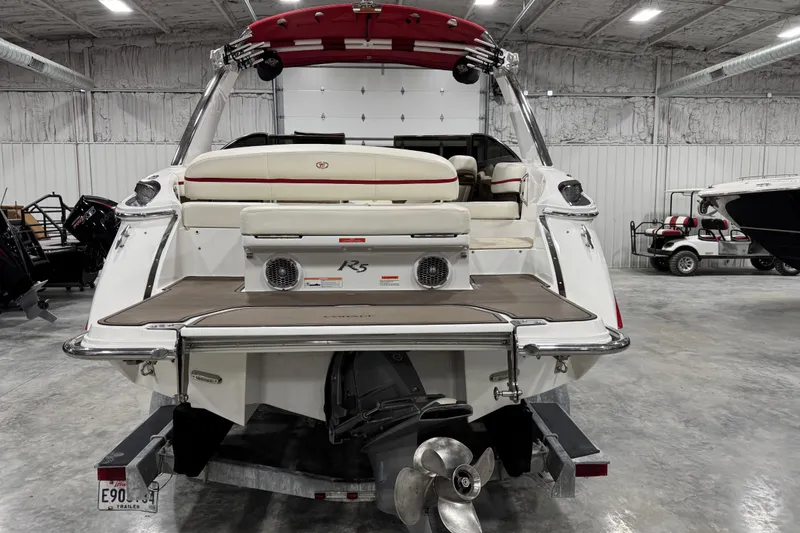Slide: The Image of Red 2014 Cobalt R5 WSS boat on trailer in indoor showroom. - 5