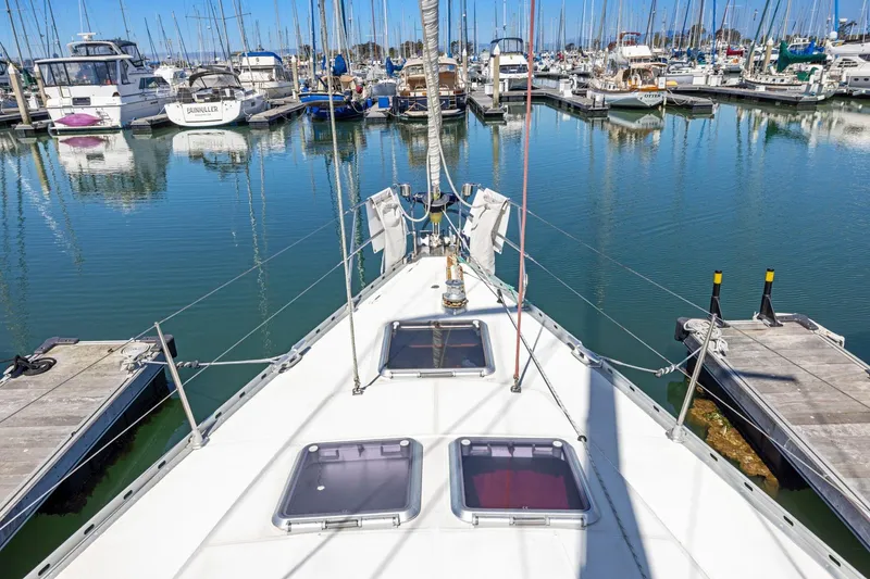 Slide: The Image of Jeanneau Sun Odyssey 52.2 sailboat docked in a marina, 2001 model. - 11