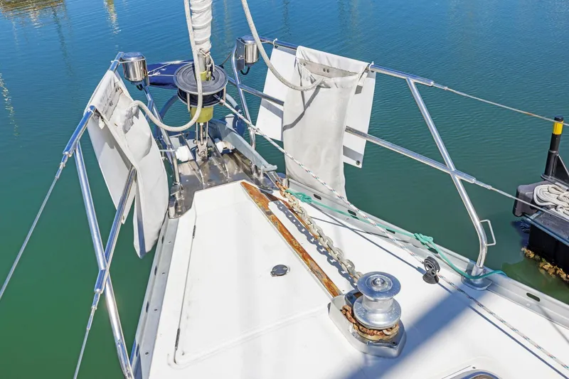 Slide: The Image of Deck of 2001 Jeanneau Sun Odyssey 52.2 sailboat with anchor chain and winch. - 12