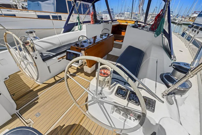 Slide: The Image of Cockpit of 2001 Jeanneau Sun Odyssey 52.2 sailboat with dual steering wheels. - 16