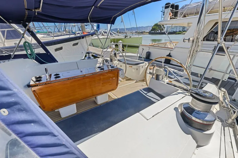 Slide: The Image of Cockpit of 2001 Jeanneau Sun Odyssey 52.2 sailboat, featuring dual steering wheels. - 19