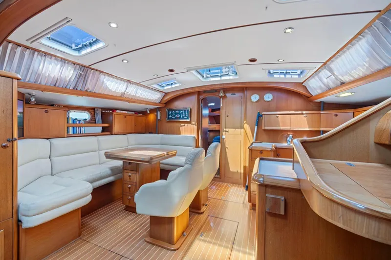 Slide: The Image of Luxurious interior of 2001 Jeanneau Sun Odyssey 52.2 yacht with elegant wood finish. - 21