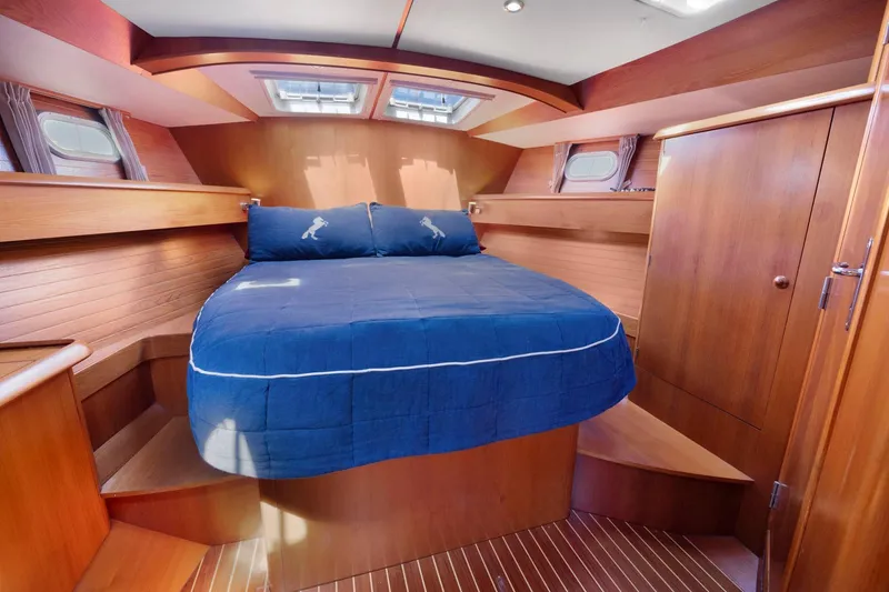 Slide: The Image of Luxurious cabin interior of 2001 Jeanneau Sun Odyssey 52.2 sailboat with wooden finish. - 36