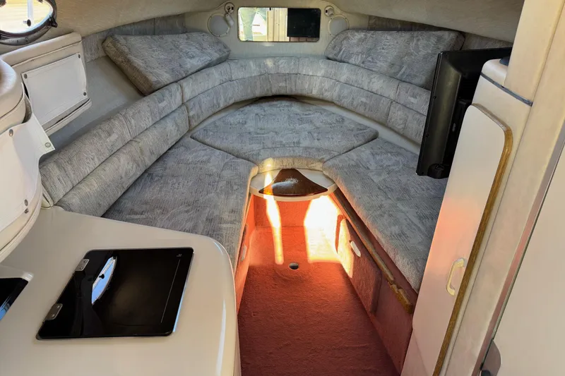 Slide: The Image of Interior of 1994 Sea Ray 270 Sundancer boat with cozy seating and modern amenities. - 22
