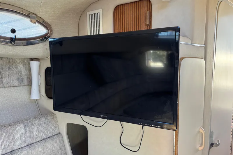Slide: The Image of Interior of 1994 Sea Ray 270 Sundancer with mounted flat-screen TV. - 24