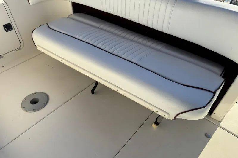 Slide: The Image of White cushioned seating on 1994 Sea Ray 270 Sundancer boat deck. - 34
