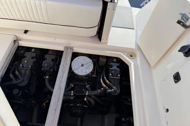 Slide: The Image of Engine compartment of a 1994 Sea Ray 270 Sundancer boat, showing detailed mechanical components. - 7
