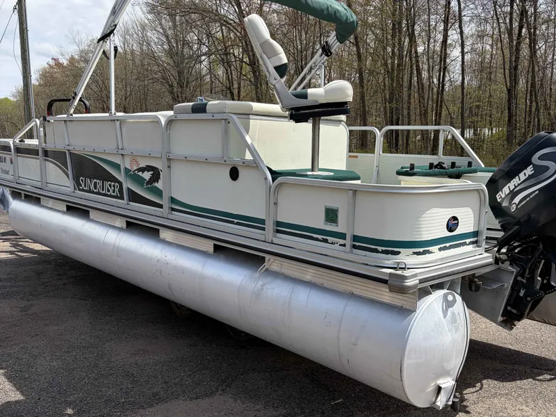 Slide: The Image of 1999 Lowe Suncruiser 22 pontoon boat with outboard motor. - 11