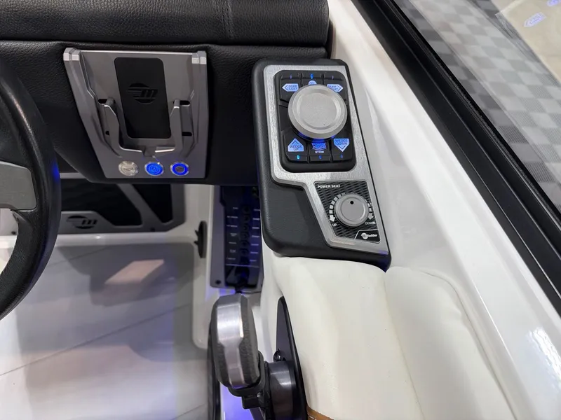 Slide: The Image of 2023 Malibu M220 interior with control console and buttons. - 20
