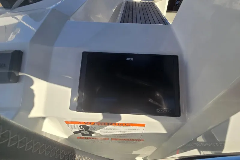 Slide: The Image of Control panel on 2023 Beneteau Oceanis 38.1 yacht, featuring a digital display and warning label. - 20