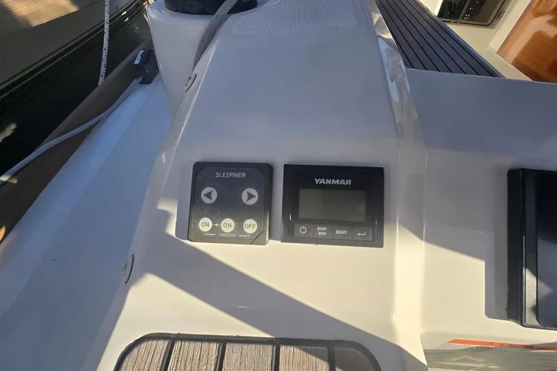 Slide: The Image of Control panel on 2023 Beneteau Oceanis 38.1 sailboat, featuring Sleipner and Yanmar displays. - 22