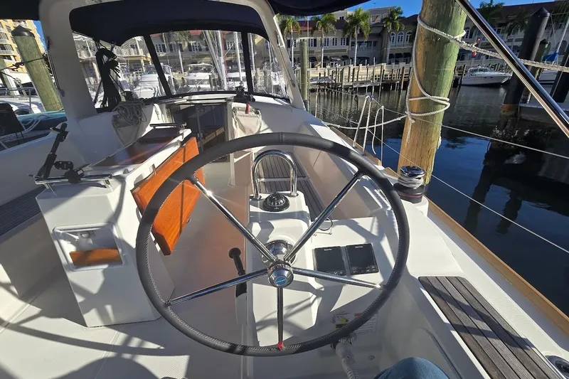 Slide: The Image of Cockpit view of 2023 Beneteau Oceanis 38.1 yacht docked at marina. - 24