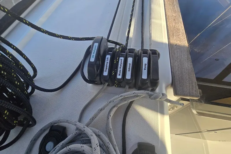 Slide: The Image of Close-up of sailing ropes and clutches on a 2023 Beneteau Oceanis 38.1 yacht. - 33
