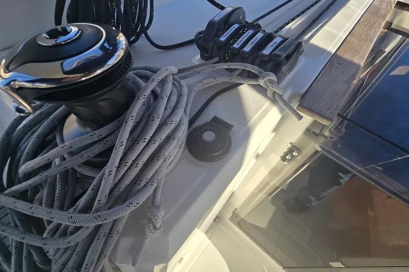 Slide: The Image of Deck of 2023 Beneteau Oceanis 38.1 with winch and ropes. - 35