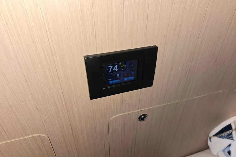 Slide: The Image of Digital control panel on 2023 Beneteau Oceanis 38.1 yacht interior. - 63