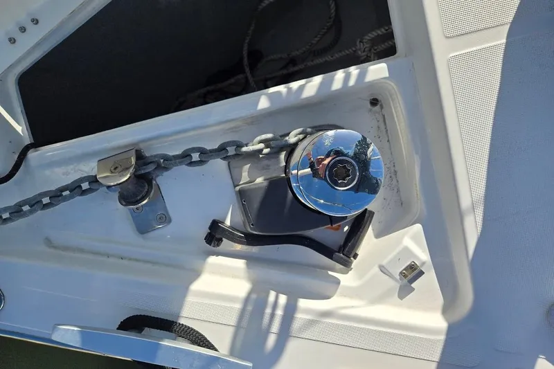 Slide: The Image of Anchor chain and winch on 2023 Beneteau Oceanis 38.1 yacht deck. - 75