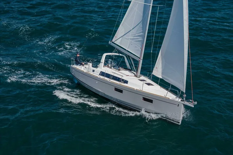 Slide: The Image of 2023 Beneteau Oceanis 38.1 sailing on open water, showcasing sleek design and performance. - 97
