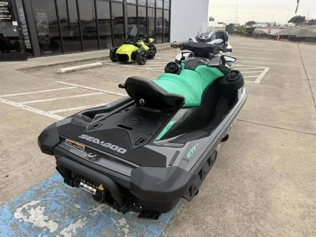 Slide: The Image of 2026 Sea-Doo GTI SE 170 jet ski in parking lot. - 8