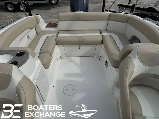 Slide: The Image of Interior of a 2018 NauticStar 243 DC Deck boat with beige seating. - 3