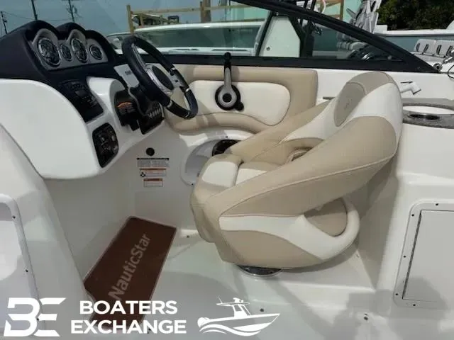 Slide: The Image of Interior of a 2018 NauticStar 243 DC Deck boat with helm console. - 5