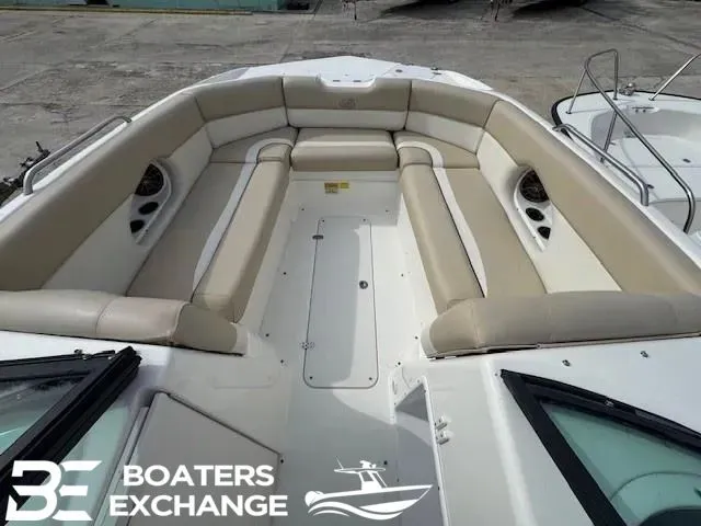 Slide: The Image of 2018 NauticStar 243 DC Deck boat with beige interior. - 7