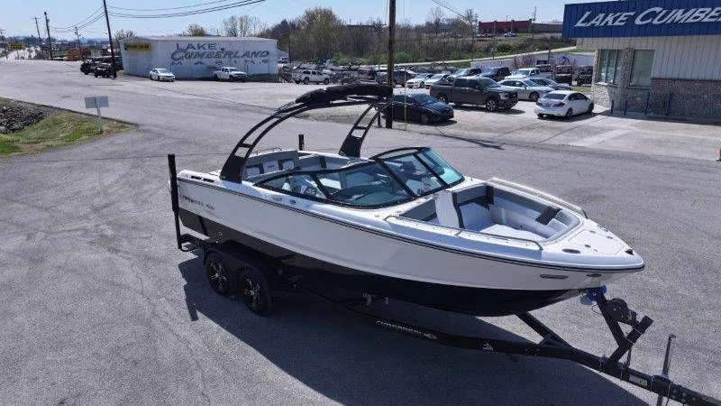 Slide: The Image of 2026 Chaparral SSX 4 boat on trailer in parking lot. - 20