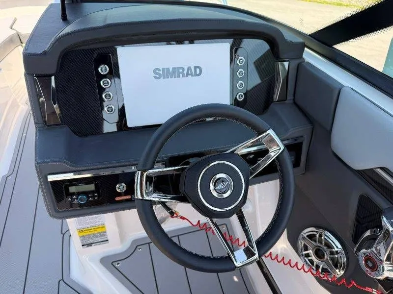 Slide: The Image of 2026 Chaparral SSX 4 helm with Simrad display and steering wheel. - 49