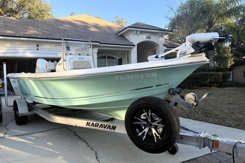 The Image of 2019 Bulls Bay 2000 boat on Karavan trailer in residential driveway. - 0