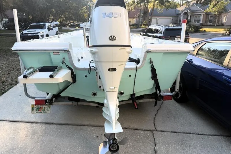 Slide: The Image of 2019 Bulls Bay 2000 boat with 140 HP engine on a driveway. - 10