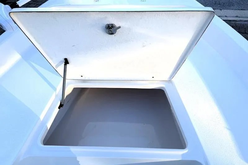 Slide: The Image of Open storage compartment on a 2019 Bulls Bay 2000 boat. - 18