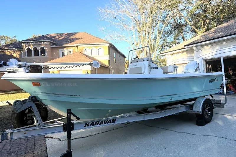 Slide: The Image of 2019 Bulls Bay 2000 boat on Karavan trailer in residential driveway. - 2